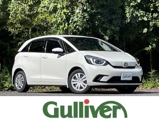 ホンダ フィット e:HEVホーム 大分県 2022(令4)年 2.7万km プラチナホワイトパール ホンダセンシング/アダプティブクルーズコントロール/レーンキープアシスト/純正メモリーナビ/バックカメラ/Bluetooth/DVD/ビルトインETC/純正LEDヘッドライト/オートライトコントロール/ハーフレザーシート/前後ドライブレコーダー/スマートキー/エンジンプッシュスタート
