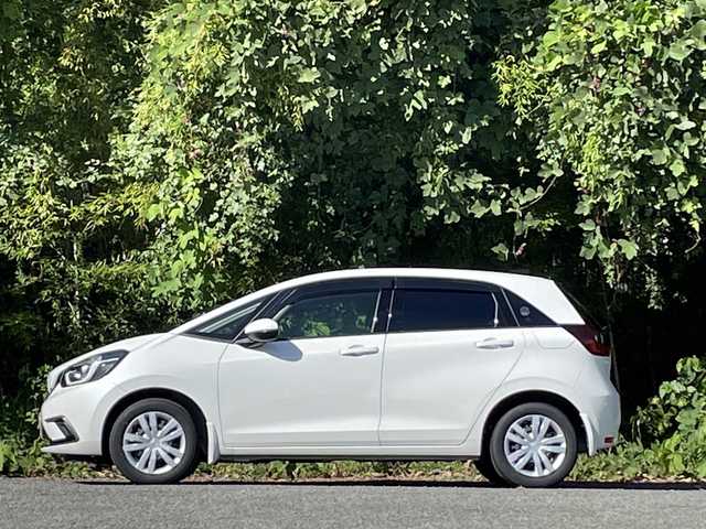 ホンダ フィット e:HEVホーム 大分県 2022(令4)年 2.7万km プラチナホワイトパール ホンダセンシング/アダプティブクルーズコントロール/レーンキープアシスト/純正メモリーナビ/バックカメラ/Bluetooth/DVD/ビルトインETC/純正LEDヘッドライト/オートライトコントロール/ハーフレザーシート/前後ドライブレコーダー/スマートキー/エンジンプッシュスタート
