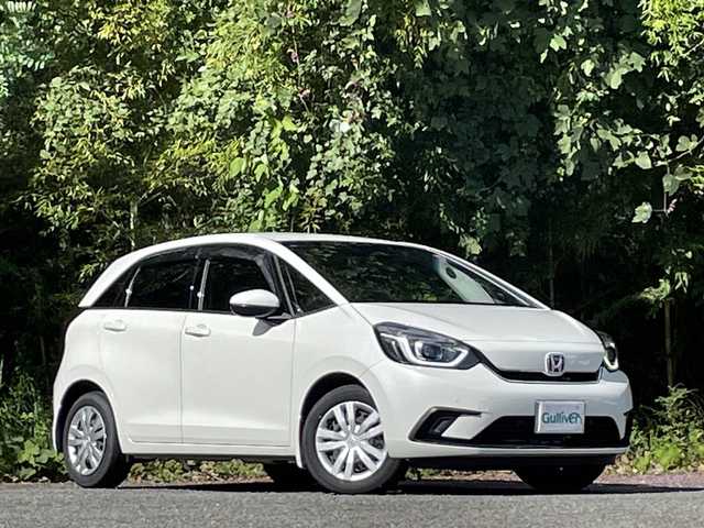 ホンダ フィット e:HEVホーム 大分県 2022(令4)年 2.7万km プラチナホワイトパール ホンダセンシング/アダプティブクルーズコントロール/レーンキープアシスト/純正メモリーナビ/バックカメラ/Bluetooth/DVD/ビルトインETC/純正LEDヘッドライト/オートライトコントロール/ハーフレザーシート/前後ドライブレコーダー/スマートキー/エンジンプッシュスタート