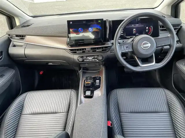 日産 オーラ G レザーエディション 熊本県 2022(令4)年 4.8万km ミッドナイトブラック/サンライズカッパー 社外ナビ/・AM/FM/BT/・フルセグTV/全周囲カメラ/エマージェンシーブレーキ/レーンキープアシスト/後側方支援/標識認識機能/ふらつき警報/オートマチックハイビーム/デジタルインナーミラー/オートライト/LEDヘッドライト/ステアリングヒーター/革シート/・前席シートヒーター/革巻きステアリング/・ステアリングスイッチ/電動パーキングブレーキ/オートホールドブレーキ/電動格納ミラー/ウインカーミラー/純正フロアマット