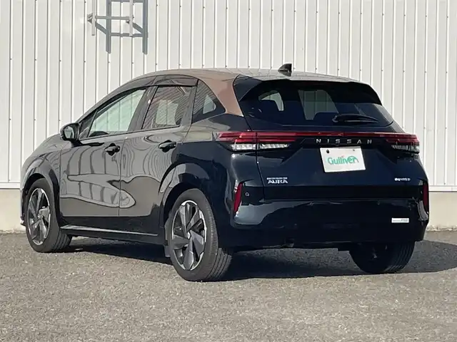 日産 オーラ G レザーエディション 熊本県 2022(令4)年 4.8万km ミッドナイトブラック/サンライズカッパー 社外ナビ/・AM/FM/BT/・フルセグTV/全周囲カメラ/エマージェンシーブレーキ/レーンキープアシスト/後側方支援/標識認識機能/ふらつき警報/オートマチックハイビーム/デジタルインナーミラー/オートライト/LEDヘッドライト/ステアリングヒーター/革シート/・前席シートヒーター/革巻きステアリング/・ステアリングスイッチ/電動パーキングブレーキ/オートホールドブレーキ/電動格納ミラー/ウインカーミラー/純正フロアマット
