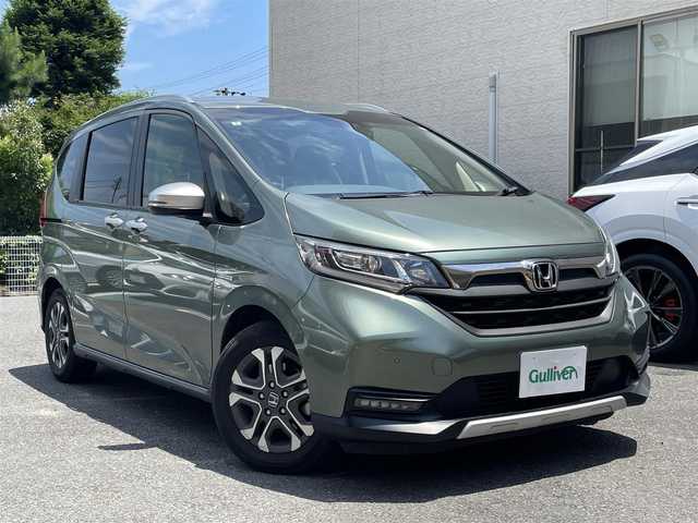 ホンダ フリード ハイブリット クロスター ホンダセンシング 静岡県 2022(令4)年 3.4万km シルバーミストグリーンM 純正ナビ/CD/SD/BT/バックカメラ/両側パワースライドドア/ハーフレザーシート/衝突軽減ブレーキ/レーンキープアシスト/レーダークルーズコントロール/クリアランスソナー/前後ドライブレコーダー/ビルトインETC/ステアリングスイッチ/LEDヘッドライト/LEDフォグライト/純正15インチAW/保証書/取扱説明書/ナビ取扱説明書/R5/R7点検記録簿有