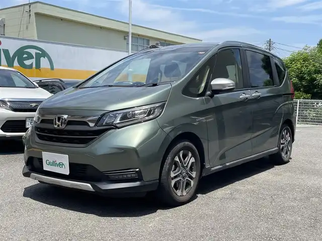 ホンダ フリード ハイブリット クロスター ホンダセンシング 静岡県 2022(令4)年 3.4万km シルバーミストグリーンM 純正ナビ/CD/SD/BT/バックカメラ/両側パワースライドドア/ハーフレザーシート/衝突軽減ブレーキ/レーンキープアシスト/レーダークルーズコントロール/クリアランスソナー/前後ドライブレコーダー/ビルトインETC/ステアリングスイッチ/LEDヘッドライト/LEDフォグライト/純正15インチAW/保証書/取扱説明書/ナビ取扱説明書/R5/R7点検記録簿有