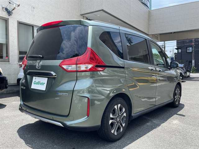 ホンダ フリード ハイブリット クロスター ホンダセンシング 静岡県 2022(令4)年 3.4万km シルバーミストグリーンM 純正ナビ/CD/SD/BT/バックカメラ/両側パワースライドドア/ハーフレザーシート/衝突軽減ブレーキ/レーンキープアシスト/レーダークルーズコントロール/クリアランスソナー/前後ドライブレコーダー/ビルトインETC/ステアリングスイッチ/LEDヘッドライト/LEDフォグライト/純正15インチAW/保証書/取扱説明書/ナビ取扱説明書/R5/R7点検記録簿有