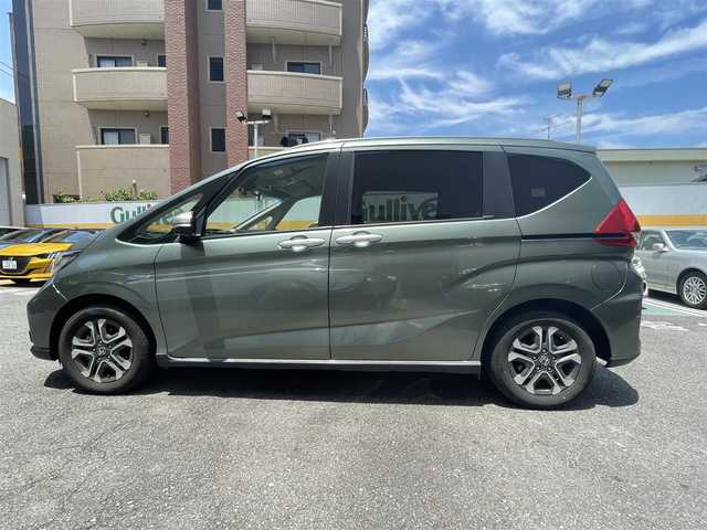 ホンダ フリード ハイブリット クロスター ホンダセンシング 静岡県 2022(令4)年 3.4万km シルバーミストグリーンM 純正ナビ/CD/SD/BT/バックカメラ/両側パワースライドドア/ハーフレザーシート/衝突軽減ブレーキ/レーンキープアシスト/レーダークルーズコントロール/クリアランスソナー/前後ドライブレコーダー/ビルトインETC/ステアリングスイッチ/LEDヘッドライト/LEDフォグライト/純正15インチAW/保証書/取扱説明書/ナビ取扱説明書/R5/R7点検記録簿有