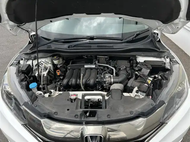 ホンダ ヴェゼル RS ホンダセンシング 佐賀県 2016(平28)年 7.3万km ホワイトオーキッドパール ワンオーナー/ホンダセンシング/レーダークルーズコントロール/純正9インチナビ/・バックカメラ/・フルセグTV/BT/CD/DVD/ハーフレザーシート/シートヒーター/純正18インチAW/革巻きステアリング/パドルシフト/電動パーキングスイッチ/LEDライト/フォグランプ/オートライト/ETC/電動格納ミラー/アイドリングストップ/ドアバイザー/スペアキー×1/取扱説明書/保証書