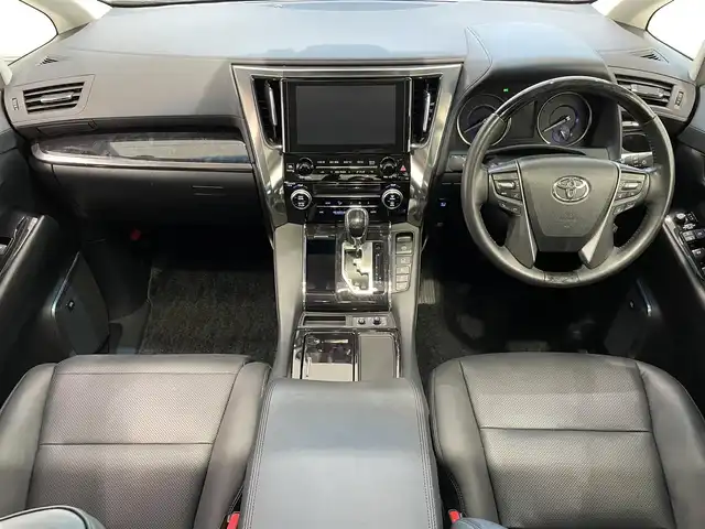 トヨタ アルファードハイブリット SR 宮城県 2019(令1)年 5.1万km ダークレッドマイカメタリック 4WD/ツインムーンルーフ/JBLサウンドシステム/後席モニター/デジタルインナーミラー/トヨタセーフティセンス/・プリクラッシュセーフティ/・レーントレーシングアシスト/・レーダークルーズコントロール/・ロードサインアシスト/・オートマチックハイビーム/純正ナビ/・アラウンドビューモニター/・Bluetooth/CD/・フルセグTV/・USB入力端子/ブラインドスポットモニター/前後コーナーセンサー/リヤクロストラフィックアラート/オートブレーキホールド/電子パーキング/前後ドライブレコーダー/LED2.0/電動リアゲート/革巻きステアリングウッドコンビ/レザーシート/・シートメモリー(運転席)/・シートベンチレーション(運転席・助手席)/・シートヒーター（運転席/助手席）/・オットマン（助手席・2列目）/AC100V充電/LEDヘッドライト/・オートライト/・フォグランプ/純正アルミホイール/純正フロアマット