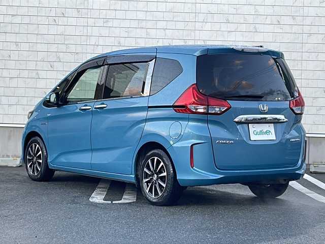 ホンダ フリード ハイブリット G ホンダセンシング 山形県 2018(平30)年 8.6万km ブルーホライゾンM 禁煙車/ホンダセンシング/・衝突軽減ブレーキ（ＣＭＢＳ）/・路外逸脱抑制機能/・先行車発進お知らせ機能/・アダプティブクルーズコントロール（ＡＣＣ）/・レーンキープアシスト（ＬＫＡＳ）/・標識認識機能/車両接近通報装置/両側パワースライドドア/純正ナビ(ＡＭ/FM/TV/BT)/純正ドライブレコーダー/ビルトインＥＴＣ/横滑り防止装置/ワイパーデアイサー