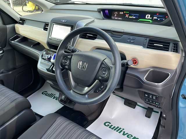 ホンダ フリード ハイブリット G ホンダセンシング 山形県 2018(平30)年 8.6万km ブルーホライゾンM 禁煙車/ホンダセンシング/・衝突軽減ブレーキ（ＣＭＢＳ）/・路外逸脱抑制機能/・先行車発進お知らせ機能/・アダプティブクルーズコントロール（ＡＣＣ）/・レーンキープアシスト（ＬＫＡＳ）/・標識認識機能/車両接近通報装置/両側パワースライドドア/純正ナビ(ＡＭ/FM/TV/BT)/純正ドライブレコーダー/ビルトインＥＴＣ/横滑り防止装置/ワイパーデアイサー