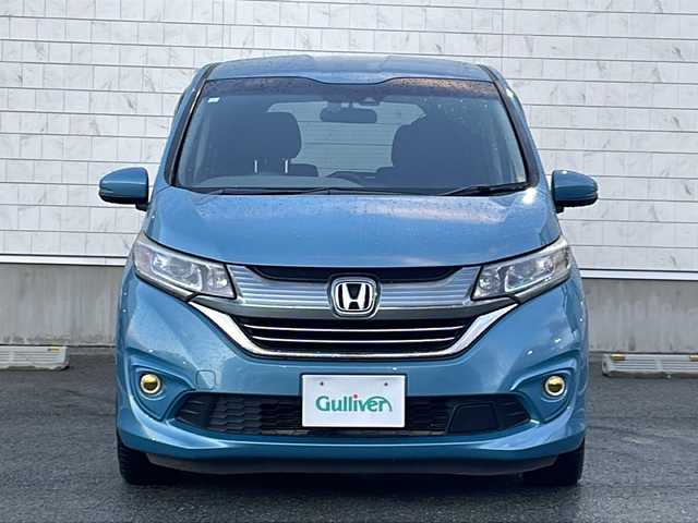 ホンダ フリード ハイブリット G ホンダセンシング 山形県 2018(平30)年 8.6万km ブルーホライゾンM 禁煙車/ホンダセンシング/・衝突軽減ブレーキ（ＣＭＢＳ）/・路外逸脱抑制機能/・先行車発進お知らせ機能/・アダプティブクルーズコントロール（ＡＣＣ）/・レーンキープアシスト（ＬＫＡＳ）/・標識認識機能/車両接近通報装置/両側パワースライドドア/純正ナビ(ＡＭ/FM/TV/BT)/純正ドライブレコーダー/ビルトインＥＴＣ/横滑り防止装置/ワイパーデアイサー