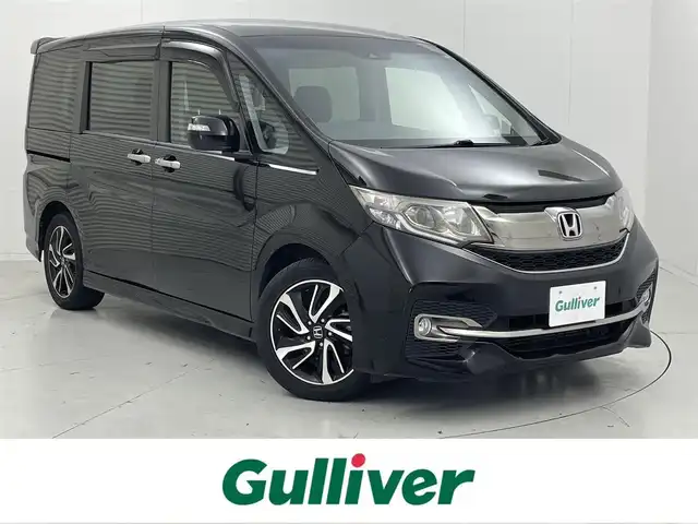 ホンダ ステップワゴン スパーダ クールスピリット 茨城県 2015(平27)年 6万km プレミアムスパークルブラックパール 純正9インチプレミアムインターナビ/Bluetooth/フルセグ/AM/FMCD/DVD/ホンダセンシング/・衝突軽減ブレーキ/・オートクルーズコントロール/・車線逸脱警報/・レーンキープアシスト/・誤発進抑制機能/・先行車発進通知/・標識認識機能/フリップダウンモニター/LEDヘッドライト/オートライト/ハーフレザーシート/シートヒーター/両側パワースライドドア/ステアリングリモコン