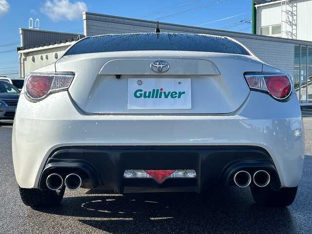 トヨタ ８６ GT 富山県 2013(平25)年 9.7万km サテンホワイトパール 社外ＳＤナビ/（CD/DVD/SD/BT/フルセグＴＶ）/バックカメラ/社外マフラー（ＴＲＤ）/純正１７インチアルミホイール/純正フロアマット/プッシュスタート/ハロゲンヘッドライト/保証書・記録簿/取扱説明書