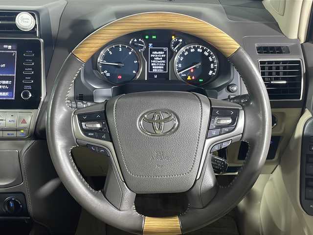 トヨタ ランドクルーザー プラド TX Lパッケージ 福岡県 2021(令3)年 5.2万km ホワイトパールクリスタルシャイン ４WD/Bluetooth接続/MIRACAST/ビルトインETC2.0/フルセグ/追従クルーズコントロール/USB端子/シートヒーター(D+N席)/エアシート(D+N席)/3列シート/AFS/フロントエアロパーツ(モデリスタ)/レーンキープアシスト/ダウンヒルアシストコントロール/スペアキー１本/D席+N席+サイドエアバック/カーテンエアバック
