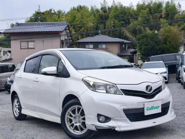 トヨタ ヴィッツ U 熊本県 2012(平24)年 13万km ホワイトパールクリスタルシャイン 4WD/モデリスタエアロ/純正HDDナビ（NHZN-W61G）/【フルセグTV/Bluetooth/CD/DVD】/バックカメラ/ETC/シートヒーター/プッシュスタート/ウインカーミラー/スペアキー/純正フロアマット/社外シートカバー/スペアタイヤ/取扱説明書