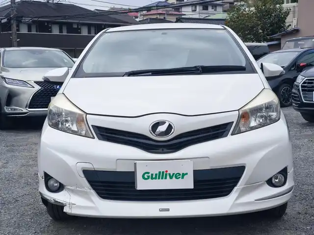 トヨタ ヴィッツ U 熊本県 2012(平24)年 13万km ホワイトパールクリスタルシャイン 4WD/モデリスタエアロ/純正HDDナビ（NHZN-W61G）/【フルセグTV/Bluetooth/CD/DVD】/バックカメラ/ETC/シートヒーター/プッシュスタート/ウインカーミラー/スペアキー/純正フロアマット/社外シートカバー/スペアタイヤ/取扱説明書