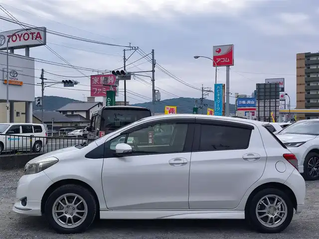 トヨタ ヴィッツ U 熊本県 2012(平24)年 13万km ホワイトパールクリスタルシャイン 4WD/モデリスタエアロ/純正HDDナビ（NHZN-W61G）/【フルセグTV/Bluetooth/CD/DVD】/バックカメラ/ETC/シートヒーター/プッシュスタート/ウインカーミラー/スペアキー/純正フロアマット/社外シートカバー/スペアタイヤ/取扱説明書