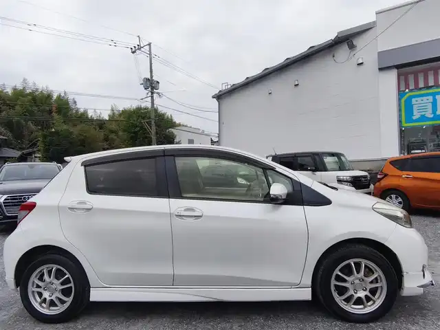 トヨタ ヴィッツ U 熊本県 2012(平24)年 13万km ホワイトパールクリスタルシャイン 4WD/モデリスタエアロ/純正HDDナビ（NHZN-W61G）/【フルセグTV/Bluetooth/CD/DVD】/バックカメラ/ETC/シートヒーター/プッシュスタート/ウインカーミラー/スペアキー/純正フロアマット/社外シートカバー/スペアタイヤ/取扱説明書