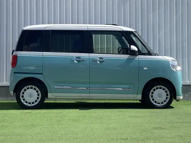 ダイハツ ムーヴ キャンバス ストライプス G 香川県 2023(令5)年 1.2万km シャイニングホワイトパール/ファインミントメタリック 登録時走行距離：11844km/ケンウッド製メモリナビ/　CD DVD BT フルセグTV/バックカメラ/両側パワースライドドア/スマートアシスト/クリアランスソナー/アイドリングストップ/横滑り防止装置/シートヒーター/ベンチシート/ISOFIX/オートホールド機能付き電子パーキングブレーキ/LEDヘッドライト/オートライト/フォグランプ/ETC/プッシュスタート/スマートキー