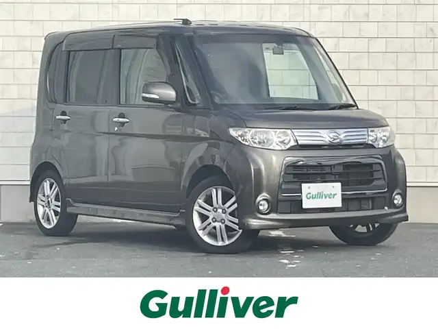 ダイハツ タント カスタム RS 愛知県 2013(平25)年 6.9万km ブロンズオリーブパールメタリック ・ターボ車/・社外製SDメモリーナビ/・バックカメラ/・フルセグTV/・CD再生/・ETC/・Bluetooth/USB/AUX接続/・助手席側パワースライドドア/・ベンチシート/・純正15インチアルミホイール/・電動格納ミラー/・T’zドライブレコーダー（前後）/・オーバーヘッドコンソール・イルミネーション機能付き/・スマートキー/・スペアキー（板キー）