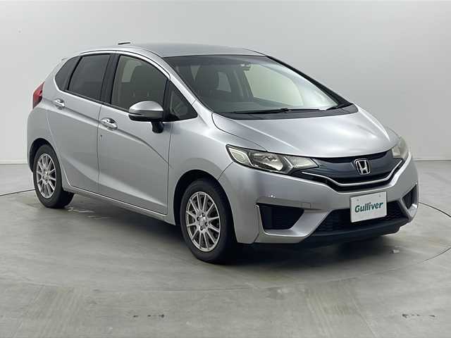 ホンダ フィット 13G Fパッケージ 栃木県 2015(平27)年 7.6万km アラバスターシルバーメタリック ストラーダSDナビ　/・CD　フルセグTV　BT　/バックカメラ　/ETC　/前方ドライブレコーダー　/プッシュスタート　/電動格納ミラー　/純正マット　/オートエアコン/純正キャップ付きサマータイヤ４本（6mm）/　