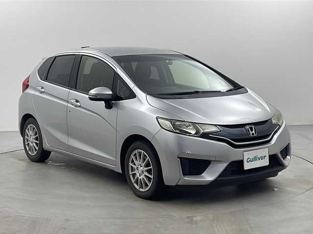 ホンダ フィット 13G Fパッケージ 栃木県 2015(平27)年 7.6万km アラバスターシルバーメタリック ストラーダSDナビ　/・CD　フルセグTV　BT　/バックカメラ　/ETC　/前方ドライブレコーダー　/プッシュスタート　/電動格納ミラー　/純正マット　/オートエアコン/純正キャップ付きサマータイヤ４本（6mm）/　