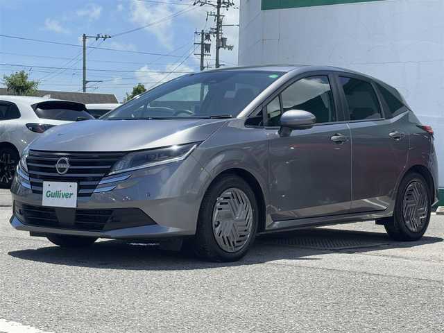 日産 ノート X 徳島県 2024(令6)年 0.4万km ダークメタルグレー 純正9インチナビ/(AM.FM.BT.フルセグ)/全周囲カメラ/バックカメラ/フルセグTV/ETC/ドライブレコーダー（前のみ）/コーナーセンサー（前後）/USB入力端子/純正フロアマット/横滑り防止装置/盗難防止装置/衝突軽減システム