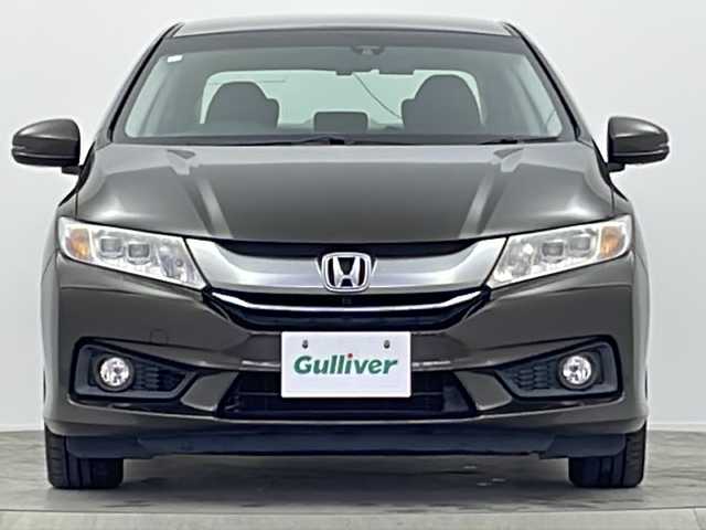 ホンダ グレイス ハイブリッド EX 大阪府 2014(平26)年 8.2万km ゴールドブラウンM 純正ナビ(フルセグTV/FM/AM/CD/DVD/MT/USB)/バックカメラ/前後ドライブレコーダー/ＥＴＣ/横滑り防止装置/盗難防止装置/クルーズコントロール　/パドルシフト/オートライト/ハーフレザー/シートヒーター/純正ＡＷ/純正フロアマット/スマートキー/スペアキー/保証書/記録簿/取扱説明書