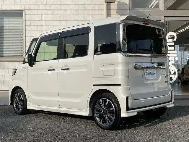 スズキ スペーシア カスタム HYBRID XS 埼玉県 2023(令5)年 0.5万km ピュアホワイトP 純正9インチナビ　/・フルセグTV　CD/DVD/Bluetooth/スズキセーフティサポート/・衝突被害軽減ブレーキ/・誤発進抑制機能/・車線逸脱警報/・リアクロストラフィックアラート/・車間距離制御機能/バックカメラ/アラウンドビューモニター/ステアリングスイッチ/クルーズコントロール/プッシュスタート/ヘッドアップディスプレイ/両側パワースライドドア/D席シートヒーター/アイドリングストップ/パーキングセンサー/純正フロアマット/純正15インチAW