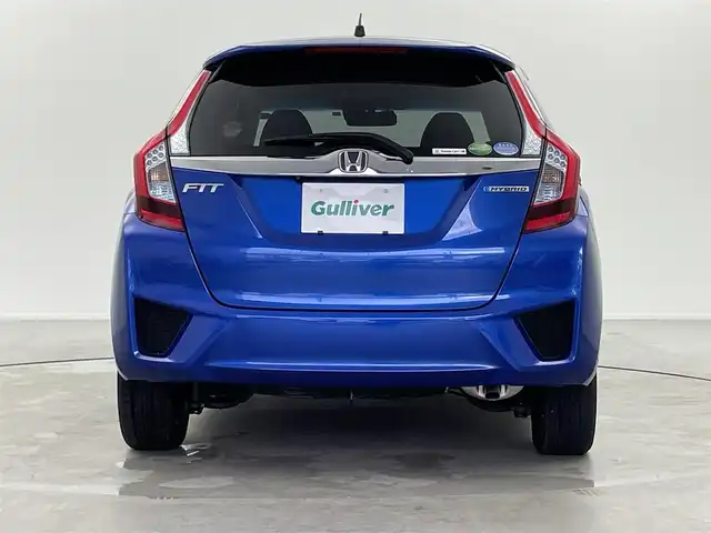 ホンダ フィット ハイブリット Fパッケージ 福井県 2014(平26)年 1.3万km ブリリアントスポーティブルーメタリック2トーン 純正ナビ/(ワンセグ/CD/MDMI/USB/Bluetooth)/バックカメラ/衝突軽減システム/ステアリングスイッチ/ETC/前方ドライブレコーダー/横滑り防止装置/電動格納ウインカーミラー/フロアマット/ドアバイザー/プッシュスタート/スマートキー/W＋サイド＋カーテンSRS＋ABS/取扱説明書