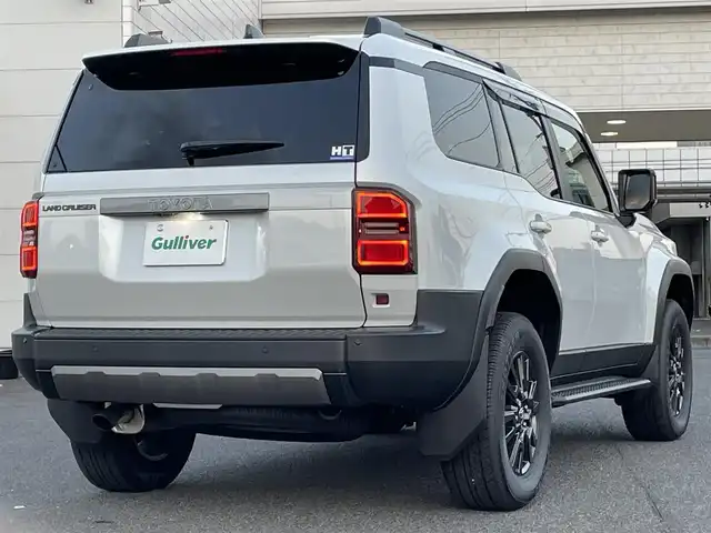 トヨタ ランドクルーザー ２５０ VX 広島県 2024(令6)年 0.1千km プラチナホワイトパールマイカ 登録時走行距離60km/ワンオーナー/サンルーフ/純正ナビ（HDMI/フルセグTV/Bluetooth）/全方位モニター/ETC2.0/デジタルインナーミラー/ルーフレール/黒レザーシート/・シートヒーター/・エアシート/・パワーシート/衝突被害軽減ブレーキ/車線逸脱警報/オートマチックハイビーム/ブラインドスポットモニター/レーダークルーズコントロール/コーナーセンサー/ステアリングヒーター/パワーバックドア/スペアキー
