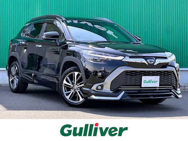 トヨタ カローラ クロス ハイブリッド Z 宮城県 2024(令6)年 2.5万km アティチュードブラックマイカ トヨタチームメイト（アドバンストパーク）/・ブラインドスポットモニター/・安心降車アシスト/・パーキングサポートブレーキ/・パノラミックビューモニター/ディスプレイオーディオプラス/・10.5インチディスプレイオーディオ/・車載ナビ/・ETC2.0/パノラマルーフ/ワイヤレス充電/アクセサリーコンセント（100V/1500W）/＝＝＝/モデリスタエアロ（F/S/R）/セーフティセンス/・プリクラッシュセーフティ/・レーントレーシングアシスト/・レーンディパーチャーアラート/・レーダークルーズコントロール/・オートマチックハイビーム/・ロードサインアシスト/・ドライバー異常時対応システム/・プロアクティブドライビングアシスト/・発進遅れ告知機能/ハンズフリーパワーバックドア/ハーフレザーシート/シートヒーター/パワーシート/電動パーキングブレーキ/ブレーキホールド/LEDヘッドランプ/LEDシーケンシャルターンランプ/フォグランプ/スマートキー＆プッシュスタート/純正18インチAW/フロアマット/ドアバイザー