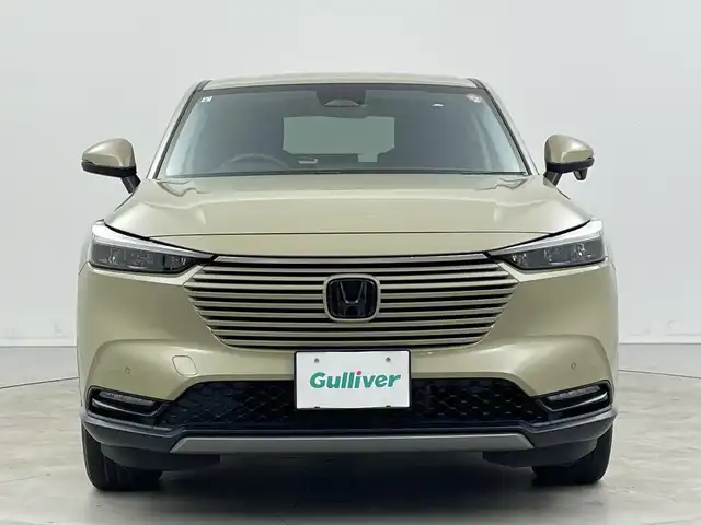 ホンダ ヴェゼル ハイブリッド e:HEV X 新潟県 2021(令3)年 4.2万km サンドカーキパール 4WD/純正メモリナビ【VXM-152VFi】/　フルセグTV/Bluetooth/CD/DVD/USB/ホンダセンシング/・衝突被害軽減ブレーキ/・踏み間違え衝突軽減システム/・急アクセル抑制機能/・歩行者事故低減ステアリング/・路外逸脱抑制機能/・レーダークルーズコントロール/・車線維持支援システム(LKAS)/・トラフィックジャムアシスト(渋滞運転支援機能)/・先行車発進お知らせ機能/・標識認識機能/・オートハイビーム/・パーキングセンサーシステム/前後コーナーセンサー/前席シートヒーター/バックモニター/ヒルディセントコントロール/LEDヘッドライト/パドルシフト