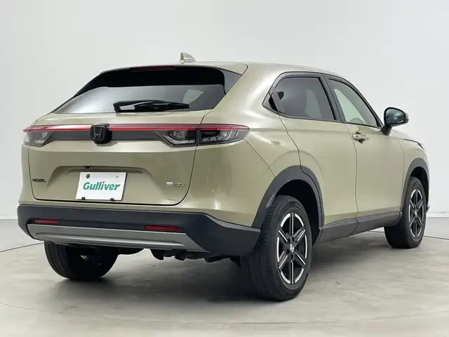 ホンダ ヴェゼル ハイブリッド e:HEV X 新潟県 2021(令3)年 4.2万km サンドカーキパール 4WD/純正メモリナビ【VXM-152VFi】/　フルセグTV/Bluetooth/CD/DVD/USB/ホンダセンシング/・衝突被害軽減ブレーキ/・踏み間違え衝突軽減システム/・急アクセル抑制機能/・歩行者事故低減ステアリング/・路外逸脱抑制機能/・レーダークルーズコントロール/・車線維持支援システム(LKAS)/・トラフィックジャムアシスト(渋滞運転支援機能)/・先行車発進お知らせ機能/・標識認識機能/・オートハイビーム/・パーキングセンサーシステム/前後コーナーセンサー/前席シートヒーター/バックモニター/ヒルディセントコントロール/LEDヘッドライト/パドルシフト