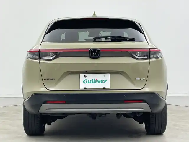 ホンダ ヴェゼル ハイブリッド e:HEV X 新潟県 2021(令3)年 4.2万km サンドカーキパール 4WD/純正メモリナビ【VXM-152VFi】/　フルセグTV/Bluetooth/CD/DVD/USB/ホンダセンシング/・衝突被害軽減ブレーキ/・踏み間違え衝突軽減システム/・急アクセル抑制機能/・歩行者事故低減ステアリング/・路外逸脱抑制機能/・レーダークルーズコントロール/・車線維持支援システム(LKAS)/・トラフィックジャムアシスト(渋滞運転支援機能)/・先行車発進お知らせ機能/・標識認識機能/・オートハイビーム/・パーキングセンサーシステム/前後コーナーセンサー/前席シートヒーター/バックモニター/ヒルディセントコントロール/LEDヘッドライト/パドルシフト