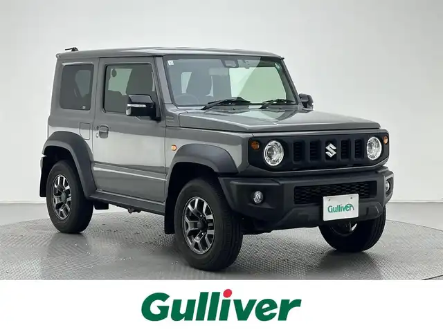 スズキ ジムニー シエラ JC 兵庫県 2020(令2)年 3.5万km ミディアムグレー ・社外メモリナビ/・バックカメラ/・前後ドライブレコーダー/・ETC/・オートクルーズコントロール/・衝突軽減ブレーキ/・レーンキープアシスト/・4WD/・LEDヘッドライト/・フォグランプ/・背面タイヤ/・純正15インチアルミホイール/・トランスファー/・シートヒーターD/N/・純正フロアマット/・スマートキー/・スペアキー1本/・プッシュスタート
