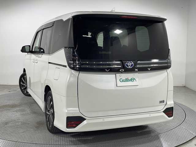 トヨタ ヴォクシー ハイブリッド S－Z 広島県 2022(令4)年 3.3万km ホワイトパールクリスタルシャイン 純正１０．５型ＤＡ/全周囲カメラ/パーキングアシスト/純正14型フリップダウンモニター/両側パワースライドドア/レーダークルーズコントロール/シートヒーター/ドラレコ/ＥＴＣ２．０/ブラインドスポットモニター/衝突軽減/レーンキープ/踏み間違い防止/オートマチックハイビーム/1500W給電/純正17インチアルミホイール(205/55/R17)/エアバッグ(運転席/助手席/サイド/カーテン)