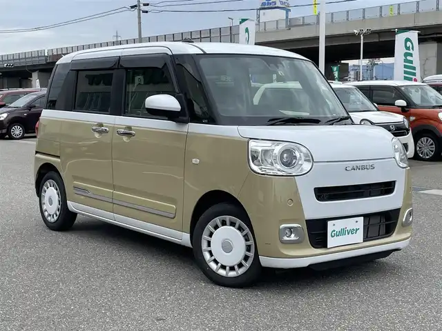 ダイハツ ムーヴ キャンバス ストライプス G 石川県 2022(令4)年 2万km シャイニングホワイトパール/サンドベージュメタリック 社外メモリーナビ/フルセグTV/バックカメラ/両側パワースライドドア/LEDヘッドライト/ドライブレコーダー/スマートアシスト/コーナーセンサー/シートヒーター/スマートキー/プッシュスタート/電動ミラー/ベンチシート/保証書