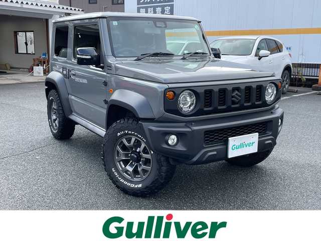 スズキ ジムニー シエラ JC 山口県 2023(令5)年 3.4万km ミディアムグレー 社外DVD/CD/BT/USB(PVH-9300DVSZS）/社外ツィーター/純正LEDヘッドライト/純正フォグランプ/オートライト/純正15インチアルミホイール/革巻きステアリング/ステアリングスイッチ/クルーズコントロール/前席シートヒーター/DAC/クリアフューエルリッド/衝突被害軽減ブレーキ/LKA/横滑り防止/アイドリングストップ/スマートキー×２/純正フロアマット/ETC/電動格納ウインカードアミラー(オート機能付き)