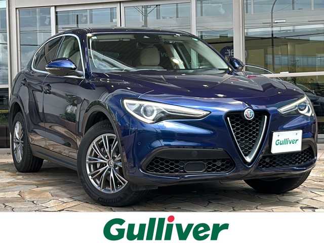 アルファロメオ ステルヴィオ ファーストエディション 静岡県 2019(令1)年 7.5万km ブルーモンテカルロ 純正メモリナビ/・Bluetooth/・USB/・AUX/・AM/・FM/主要装備/・衝突軽減/・追従クルコン/・バックカメラ/・コーナーセンサー/・ETC/・オートライト/・オートハイビーム/・純正ドラレコ前後/・シートヒーター/・ハンドルヒーター/・フォグランプ/・純正アルミホイール/・純正フロアマット/・スマートキー/・プッシュスタート