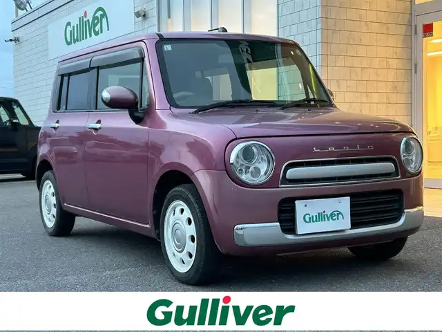 スズキ ラパン ショコラ X 香川県 2014(平26)年 6.9万km カシスピンクパールメタリック 登録時走行距離：68872km/純正ナビゲーション/【地デジ/BT/SD/idod】/衝突被害軽減ブレーキ/バックカメラ/ビルトインETC/アイドリングストップ/HIDヘッドライト/オートライト/横滑り防止装置/誤発進抑制装置/電動格納ミラー/純正フロアマット/ベンチシート/スマートキー/スペアキー