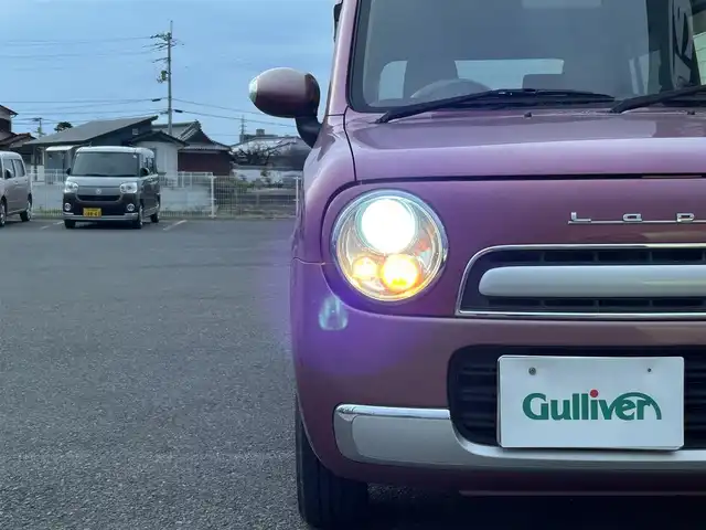 スズキ ラパン ショコラ X 香川県 2014(平26)年 6.9万km カシスピンクパールメタリック 登録時走行距離：68872km/純正ナビゲーション/【地デジ/BT/SD/idod】/衝突被害軽減ブレーキ/バックカメラ/ビルトインETC/アイドリングストップ/HIDヘッドライト/オートライト/横滑り防止装置/誤発進抑制装置/電動格納ミラー/純正フロアマット/ベンチシート/スマートキー/スペアキー