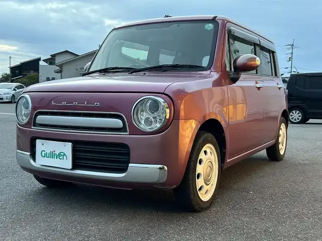 スズキ ラパン ショコラ X 香川県 2014(平26)年 6.9万km カシスピンクパールメタリック 登録時走行距離：68872km/純正ナビゲーション/【地デジ/BT/SD/idod】/衝突被害軽減ブレーキ/バックカメラ/ビルトインETC/アイドリングストップ/HIDヘッドライト/オートライト/横滑り防止装置/誤発進抑制装置/電動格納ミラー/純正フロアマット/ベンチシート/スマートキー/スペアキー