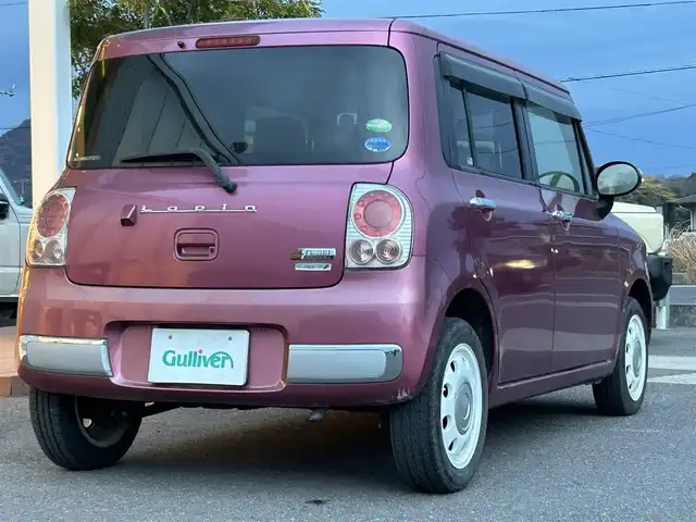 スズキ ラパン ショコラ X 香川県 2014(平26)年 6.9万km カシスピンクパールメタリック 登録時走行距離：68872km/純正ナビゲーション/【地デジ/BT/SD/idod】/衝突被害軽減ブレーキ/バックカメラ/ビルトインETC/アイドリングストップ/HIDヘッドライト/オートライト/横滑り防止装置/誤発進抑制装置/電動格納ミラー/純正フロアマット/ベンチシート/スマートキー/スペアキー