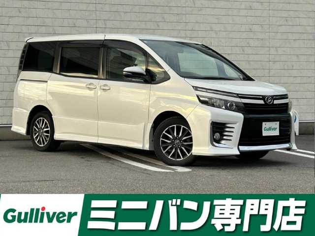 トヨタ ヴォクシー ZS 福岡県 2014(平26)年 7.8万km ホワイトパールクリスタルシャイン 純正7型SDナビ(フルセグTV/CD/DVD/BT)バックカメラ後席フリップダウンモニター両側パワスラETC純正フロアマット純正LEDヘッドライト純正16インチアルミホイールプッシュスタートスマートキー