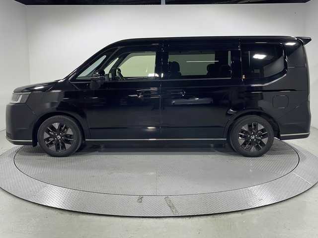 ホンダ ステップワゴン スパーダ eHEV 広島県 2022(令4)年 2.8万km クリスタルブラックパール 純正11.4型ナビ/純正15.6型フリップダウンモニター/両側パワースライドドア/バックカメラ/ハーフレザーシート/シートヒーター/パワーテールゲート/オットマン/ホンダセンシング/・衝突軽減ブレーキ/・誤発進抑制機能/・アダプティブクルーズコントロール/・レーンキープアシスト/・オートハイビーム/・パーキングセンサー/・ブラインドスポットインフォメーション/パドルシフト/LEDヘッドランプ/純正16インチAW/USB入力端子/ETC