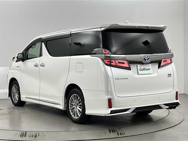 トヨタ ヴェルファイア ハイブリット ZR 埼玉県 2018(平30)年 4.7万km パール 純正10インチナビ/(FM・AM・CD・DVD・SD・BT)/ETC2.0/両側パワースライドドア/レザーシート/オートLEDライト/フルセグテレビ/12型純正フリップダウンモニター/クリアランスソナー/バックカメラ/パワーシート/エアーシート/パワーバックドア/モデリスタエアロ/レーダークルーズコントロール/デジタルミラー/シートポジションメモリー/PCS/車線逸脱警報