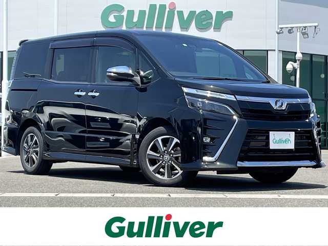 トヨタ ヴォクシー ZS 煌Ⅱ 佐賀県 2020(令2)年 6.2万km イナズマスパーキングブラックガラスフレーク 純正10インチナビ/・フルセグTV/CD/DVD/SD/Bluetooth/フリップダウンモニター /バックカメラ/両側パワースライドドア/前後ドライブレコーダー/クルーズコントロール/アイドリングストップ/シートバックテーブル/コーナーセンサー/プッシュスタート/スマートキー/ビルトインETC/オートライト/LEDヘッドライト/純正フロアマット/純正ドアバイザー