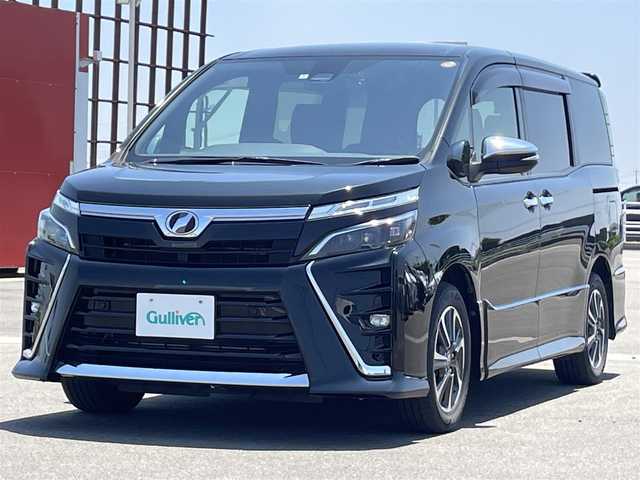 トヨタ ヴォクシー ZS 煌Ⅱ 佐賀県 2020(令2)年 6.2万km イナズマスパーキングブラックガラスフレーク 純正10インチナビ/・フルセグTV/CD/DVD/SD/Bluetooth/フリップダウンモニター /バックカメラ/両側パワースライドドア/前後ドライブレコーダー/クルーズコントロール/アイドリングストップ/シートバックテーブル/コーナーセンサー/プッシュスタート/スマートキー/ビルトインETC/オートライト/LEDヘッドライト/純正フロアマット/純正ドアバイザー