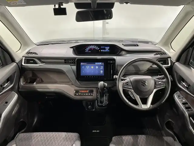 スズキ ソリオ バンディット HV MV 愛知県 2023(令5)年 3万km スーパーブラックパール 純正９インチナビ　/（CD・DVD再生/フルセグTV/FM/AM/Bluetooth/USB/スマートフォン連携）/アラウンドビューモニター　/衝突軽減ブレーキ（デュアルブレーキサポートII）/レーダークルーズコントロール　/ビルトインＥＴＣ　/シートヒーター　/前後ドライブレコーダー　/ヘッドアップディスプレイ　/片側パワースライドドア　/ＬＥＤヘッドライト/LEDフォグランプ/パーキングセンサー/車線逸脱警報/アイドリングストップ/後席サンシェード/プッシュスタート/　　-スマートキー/USB接続/純正フロアマット