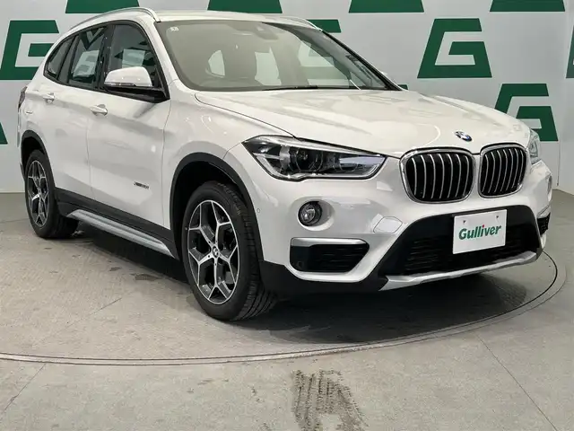 ＢＭＷ Ｘ１ xDrive 20i Xライン 鹿児島県 2017(平29)年 2.8万km アルピンホワイトⅢ 純正HDDナビ/（CD/DVD/Bluetooth/AUX/AM/FM）/ETC/社外前後ドライブレコーダー/リアビューカメラ/パーキングアシスト/ステアリングリモコン/クルーズコントロール/ハーフレザーシート/パワーバックドア/純正LEDヘッドライト/フロントフォグランプ/オートライト/衝突被害軽減ブレーキ/車線逸脱警報機能/前車接近警報機能/ダイナミックトラクションコントロール/サーボトロニック/レーンディパーチャーウォーニング/エコプロ・コンフォート・スポーツモード/前後コーナーセンサー/ルーフレール/電動パーキングブレーキ/純正フロアマット/純正18インチアルミ